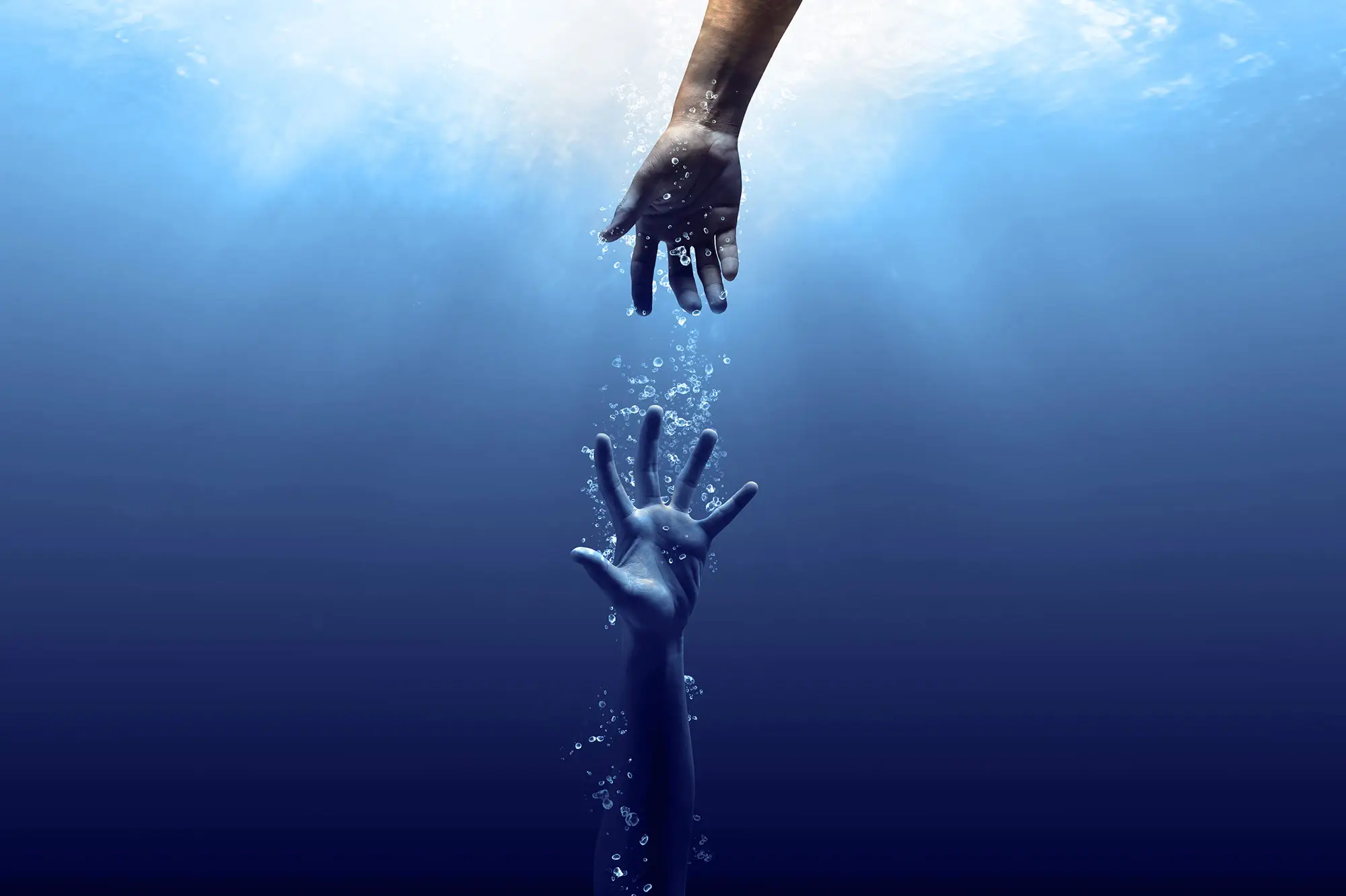 hands reaching in water